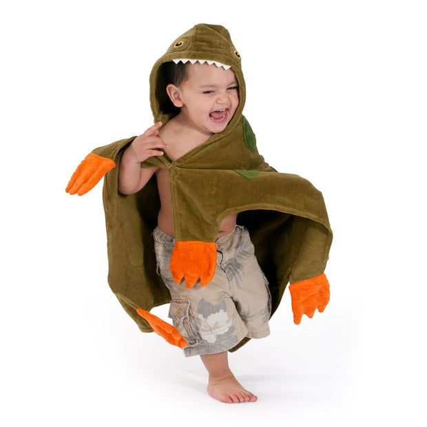 boy stomping around with hooded dino towel on