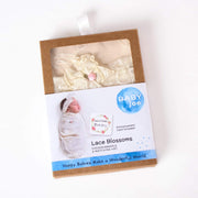 Lace Blossoms in the original packaging, welcome your newborn with this wonderful gift in rectangle box with picture of baby wrapped in swaddle.
